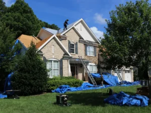 Roof installation in progress - full view of house