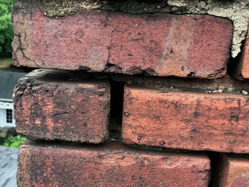 Brick chimney missing mortart - Artisan Quality Roofing Brick chimney with damaged mortar bed