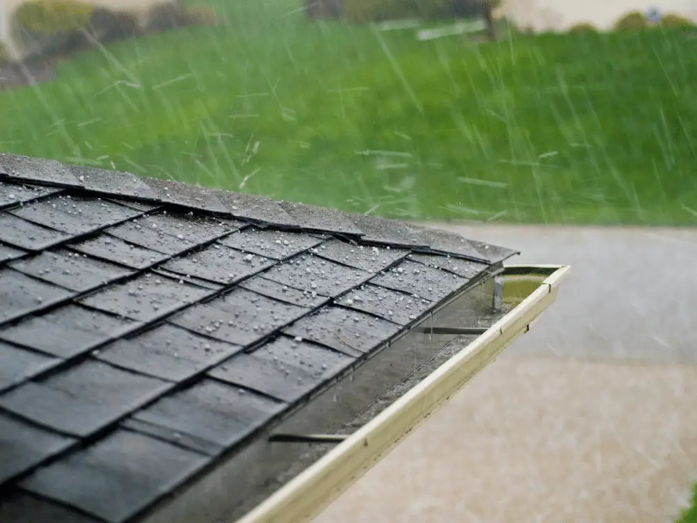Hail falling on asphalt shingle roof - Artisan Quality Roofing Hail falling on asphalt shingle roof