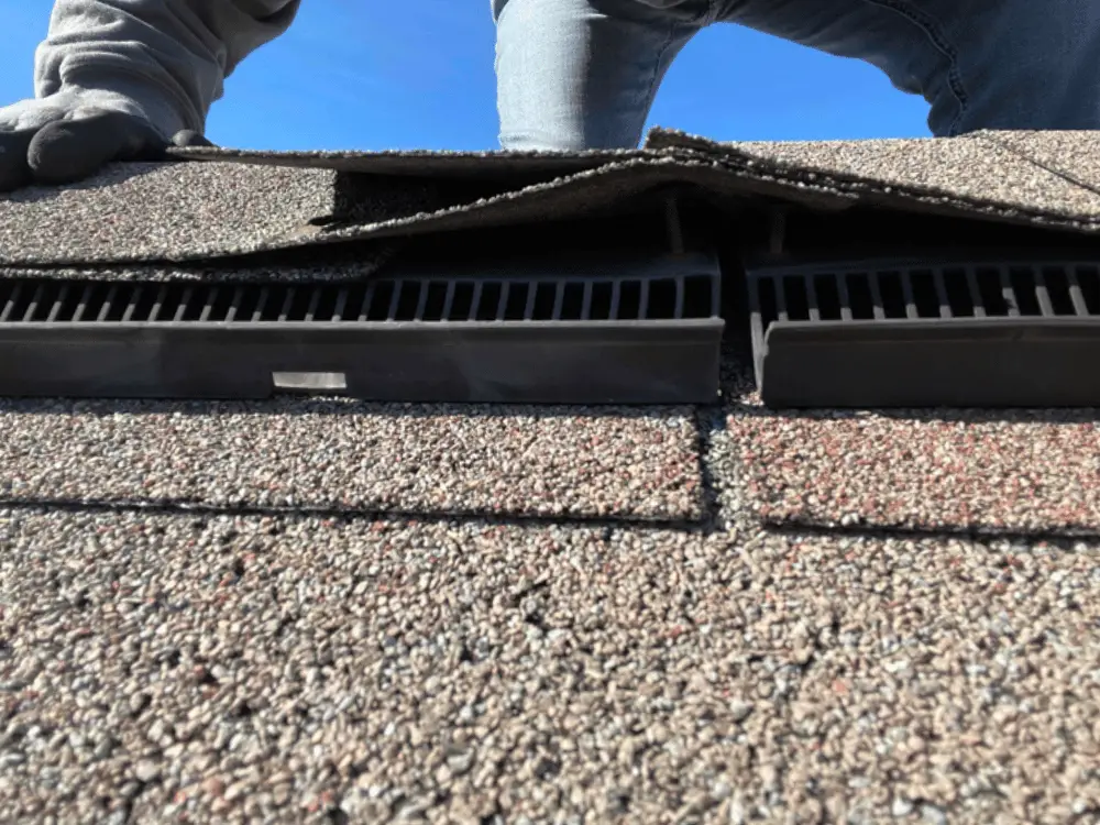 131 - Artisan Quality Roofing Technician inspects roof nail pop on ridge vent