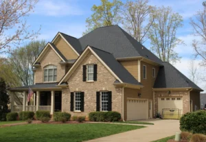 Beautiful brick house with Landmark Moire Black roof and black shutters