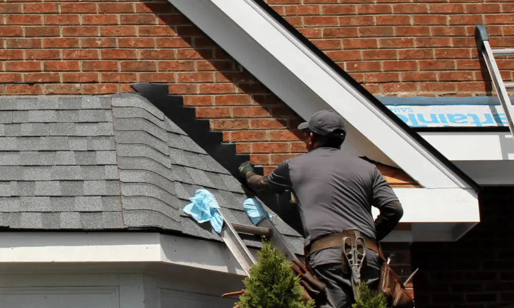 Technician installs brick flashing