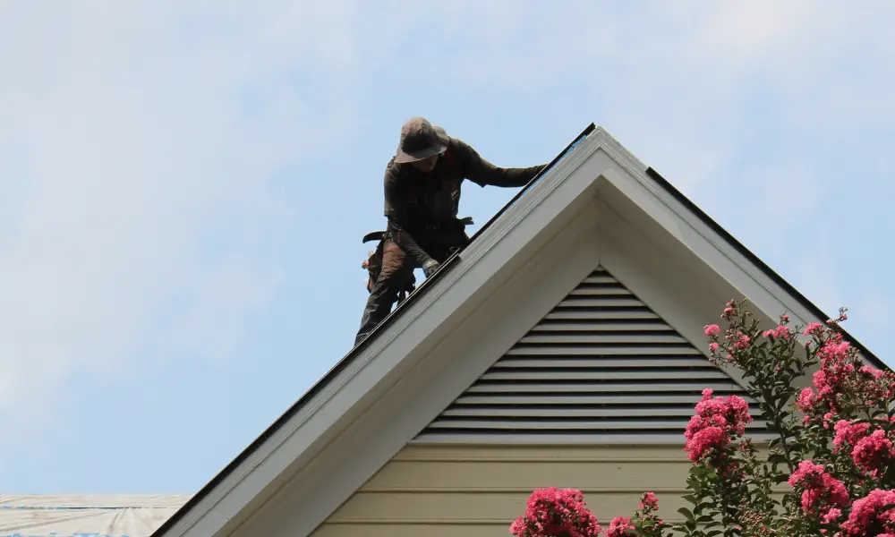 Technician intalls drip edge - ice dam prevention