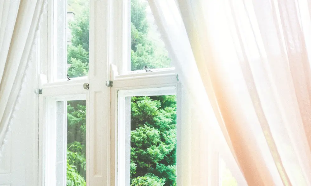 Window and curtains in sunlight