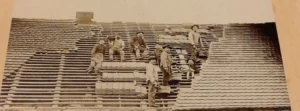 Roofing crew on a roof in the 1800's